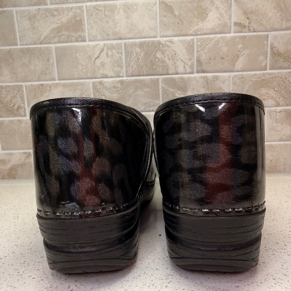 Dansko Black Leopard Print Clogs - image 4